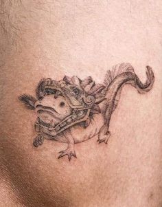 a man's stomach with a horse and money tattoo on it