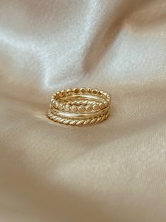 This stacking ring set features one smooth band, one twist band and one flat beaded band. Perfect to stack with rings you already own or wear as a minimal set. All rings are 14k gold filled Fit is true to US ring sizes Adjustable Stackable Rings In 14k Gold Filled, Modern Twist Stackable 14k Gold Midi Rings, Modern Twist Stackable Midi Rings, Flat Rings, Wedding Ring Finger, Red Gemstone Ring, Collection Ideas, Chic Rings, Aesthetic Jewelry