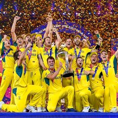 the australian team celebrates with the trophy after winning the cricket world cup in melbourne, australia