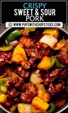 a bowl filled with meat and vegetables on top of a wooden table next to a sign that says crispy sweet & sour pork