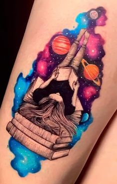 a tattoo on the leg of a woman with an image of saturn and other planets