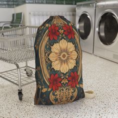 a laundry bag sitting on the floor next to a washing machine