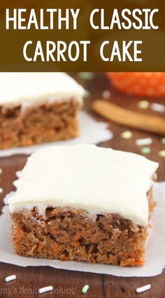 carrot cake with white frosting on top and sprinkles around the edges