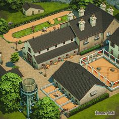 an aerial view of a horse stable and its surrounding area, including a water tower