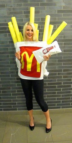 a woman is dressed up as a mcdonald's character with fries in her hands