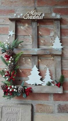 an old window is decorated with christmas decorations