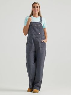 BUILT FOR ANYTHING For hard-working women on the move, the Women's Wrangler® RIGGS WORKWEAR® Relaxed Work Overall is the perfect companion. Combining fashion and function with rough and tumble craftsmanship, this relaxed-fit, loose leg cotton overall handles your toughest days with ease, with just enough stretch to always move with you. With adjustable straps and workwear favorite features, including a zippered chest pocket, zippered back thigh pocket, a utility thigh pocket, double-layered knee Work Jumpsuit, Wrangler Women, Farm Work, Hard Working Women, Work Wear Women, Work Outfits Women, Denim Overalls, Dream Wardrobe, Boho Outfits