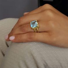 You'll fall in love with the light blue color of this Blue Topaz Quartz ring. This stone is beautifully faceted and bezel set in an 18k solid gold band. ◈ DETAILS Metal - 18K Gold Weight - 5 Gram Shank width Lower part 2mm / 0.08'' Shank width Upper part 5mm / 0.2'' Gemstone - Blue topaz 10x10 mm / 0.39''x0.39'' ◈ ALSO AVAILABLE IN Yellow, Rose, or White Gold ◈ SHIPPING is insured express and free worldwide ◈ GIFT WRAPPING is included with every purchase ✧ Looking for more unique and beautiful g Unique Gemstone Engagement Rings, Gold Topaz Ring, 18k Gold Engagement Ring, December Birthstone Jewelry, December Birthstone Ring, Blue Engagement Ring, Blue Topaz Engagement Ring, Topaz Engagement Ring, Solid Gold Band