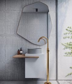 a bathroom with a sink, mirror and shelf in the corner next to a window