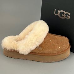 Brand: UGG Australia Model: Disquette embellished with beautiful Swarovski Rhinestones  Swarovski color: Golder Shadow   Style#: 1122550 Color: Chestnut Size: US8 Measurement - insole inches 10 from heel to toe  Material: Suede Buyer will receive slippers And box displayed in listing photos ( slippers have been reboxed in white shoebox. Original box was damaged) All merchandise is guaranteed authentic. See left slipper hologram tag  -size labels have been marked with red marker  to prevent store returns! ALL ORDERS SHIP PRIORITY MAIL WITH SIGNATURE CONFIRMATION. PLEASE MAKE SURE YOUR ADDRESS IS CORRECT. LABELS ARE PRINTED THROUGH ETSY.  NO ADDRESS CHANGES AFTER PURCHASE TO PREVENT FRAUDULENT TRANSACTIONS.  ALL SALES ARE FINAL Brown Uggs, Cute Uggs, Colorado Style, Pretty Sneakers, Gamer Pics, Winter Gear, Fresh Shoes, Ugg Slippers, Girly Shoes