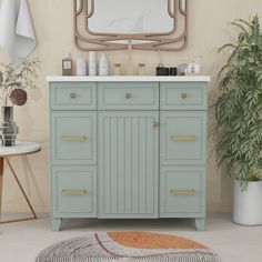 a bathroom vanity with a mirror above it and a rug on the floor next to it