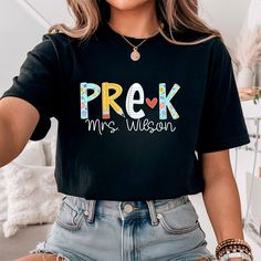 a woman wearing a black t - shirt that says prek mrs wilson