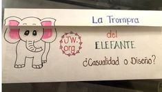 a paper sign with an elephant on it and spanish words written in the bottom corner