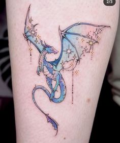 a blue dragon with stars on its back leg tattoo design by @ 2 / 3