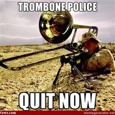 an image of a trombone on the ground with caption that reads, trombonee police quit now