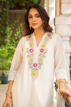 Ivory kurta with thread embroidered floral patterns. Comes with matching palazzo and dupatta. - Aza Fashions White V-neck Blouse With Intricate Embroidery, White V-neck Top With Intricate Embroidery, White Bohemian V-neck Sets, Festive V-neck Kurta For Spring, Traditional V-neck Tops With Intricate Embroidery, Cream V-neck Blouse With Floral Embroidery, Elegant V-neck Kurta For Summer, Spring Festive V-neck Kurta, Festive Spring V-neck Kurta