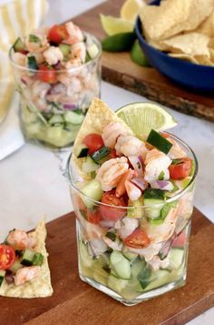 shrimp and cucumber salad in a glass with tortilla chips on the side