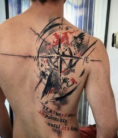 a man with a compass tattoo on his back