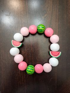 Hand-painted watermelon bracelet with an elastic band. It's about 3 and a half inches across so if your wrist is smaller than that it will probably be a little loose but anything over that should fit perfectly! Beads are made of wood and painted with acrylic paint, then sealed with a glossy finish. Watermelon Bracelet, Pink Fox, Made Of Wood, Acrylic Paint, Elastic Band, Beaded Bracelet, Labour Day, Watermelon, Jewelry Bracelets