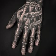 a person's hand with tattoos on it