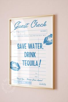 a sign on the wall that says guest check save water, drink tequila