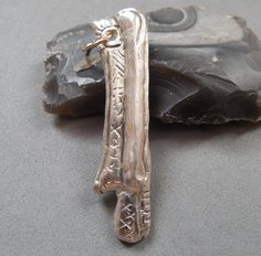 Rare Original Viking silver amulet knife solar signs, Ancient Pendant, Viking Mascot, Antique Vikings amulet, Kievan Rus artifact TOn the front of the amulet you can see symbols, signs that have a sacred and protective meaning. The amulet is well cleaned mechanically to show its beauty. The ear is whole, which makes it suitable for wearing. Photo before cleaning is available A good antique artifact for connoisseurs of antiquity. Weight: 12.84 g. Dimensions: 59*16 mm SHIPPING Shipping takes approximately 7-15 business days depending on the buyer's country. EUROPE/UK => 8-15 business days USA/Canada => 10-20 business days Japan, Taiwan => 10-25 business day Australia/N. Zealand => 10-25 business days RETURN POLICY & FEEDBACK If for any reason you are not satisfied with my item, please contac Ancient Pendant, Viking Mascot, Kievan Rus, Artifacts, Vikings, Return Policy, Australia, The Originals, Pendant