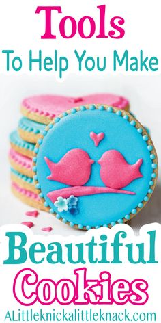 some cookies that are decorated with pink and blue icing