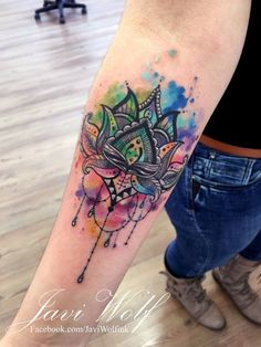 a woman with a colorful tattoo on her arm