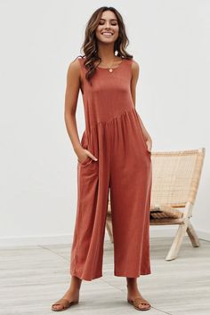 Jumpsuit100% CottonImportedConean Exclusive! The Always Thriving V-back Casual Tank Jumpsuit makes looking chic a breeze! Lightweight woven linen blend fabric makes this comfy jumpsuit perfect for kicking back in. while a V-neck. wide-strappy shoulders. and an open back keeps you looking like a true trendsetter. Low-cut sides and a relaxed waist carry into wide-cut cropped pant legs with side-seam pockets. Shipping & Return Receiving time = Processing time + Shipping time Processing Time: 1-2 Bu Elegant Rompers, Womens Jumpsuits Casual, Tank Jumpsuit, Comfy Jumpsuits, Boho Jumpsuit, Jumpsuit Dressy, Casual Tanks, Jumpsuit Outfit, Cute Rompers