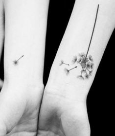 two people holding hands with tattoos on their wrists and one has a dandelion tattoo