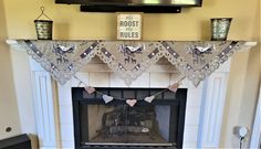 a living room with a fire place and mantle decorated for halloween time, including decorations