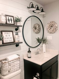 a white bathroom with black and white decor