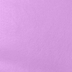 a close up view of a light purple background