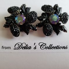 "DESCRIPTION:- EARRINGS    Vintage Earrings from the 40s - 50s - Black  Molded Leaves - Black Lava Gems - Rhinestones  - Clip backs - Pretty near Mint condition - Fun to wear and great for your collection  - Aurora borealis center Stone - marquise rhinestones.  - Quite a Unique brooch WELCOME to \"SHOPDELIALARA\". I am glad you are visiting my Etsy Shop. I have collected vintage jewelry since I was in my 20s - buying in garage sales, thrift stores and estate sales. Collecting was fun. I am 86 and now I am more interested in selling. I always say, \"when you buy jewelry, wear it and save it.\" Save it as an investment, as in time it grows in value.  REFUNDS AVAILABLE for singularly sold jewelry and jewelry sets that are damaged during transport.  Group sales are final. EXTRA - Jewelry you s Retro Earrings For Evening, Retro Metal Earrings For Evening, Retro Jewelry For Pierced Ears For Parties, Vintage Black Earrings For Wedding, Black Vintage Clip-on Earrings, Vintage Screw Back Earrings For Evening, Vintage Clip-on Jewelry For Evening, Vintage Evening Clip-on Jewelry, Black Retro Clip-on Jewelry