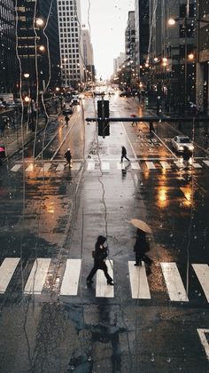 a person walking across a street in the rain with an umbrella over their head and a quote above it