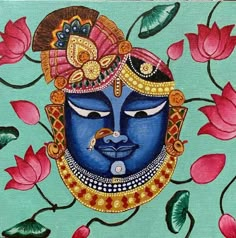 a painting of a blue face surrounded by pink flowers and leaves on a green background