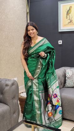 This is pure silk handloom Paithani with silver zari natural border and parrot pallu. The deep shiny green color with pure zari border and pallu adds extra royalness in it. Green Traditional Wear With Zari Weaving In Paithani Silk, Green Paithani Silk Traditional Wear With Zari Weaving, Green Meenakari Paithani Silk Dupatta, Green Paithani Silk Dupatta With Meenakari, Green Paithani Silk Saree For Festivals, Green Bollywood Paithani Silk Saree, Festival Green Paithani Silk Saree, Green Paithani Silk Dupatta With Pallu, Dark Green Traditional Wear With Cutdana