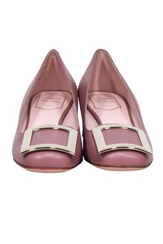 Be a boss babe in these standout mauve leather pumps from Roger Vivier! Featuring a large buckle toe detail and low block heel, these snazzy shoes make any work wardrobe extra special. Strut confidently and rock the office with ease. Size 12 (IT 42) Made in Italy 100% Leather Slip on Large buckle toe detail Block heel Heel height 2" Modern Pink Heels With Buckle Closure, Luxury Pink Heels With Buckle Closure, Slip-on Mules With Buckle Closure And Round Toe, Pink Slip-on Heels With Leather Sole, Pink Slingback Pumps With 4-inch Heel And Round Toe, Roger Vivier Shoes, Chunky Heel Pumps, Buy Shoes Online, Low Block Heels