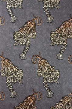 an image of a tiger pattern on a gray background that is very similar to the fabric