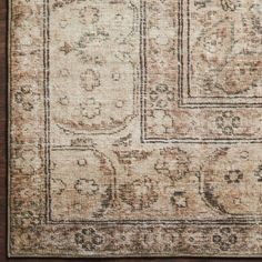 an old rug with many different designs on it, including squares and rectangles