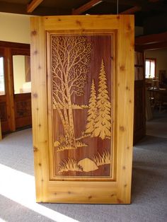 an image of a wood carving on display in a room with carpeted flooring