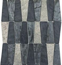 a black and white mosaic tile pattern on the wall with gray squares in it's center