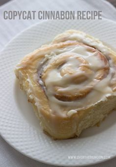 a close up of a plate of food with cinnamon rolls on it and text overlay that reads copycat cinnamon recipe