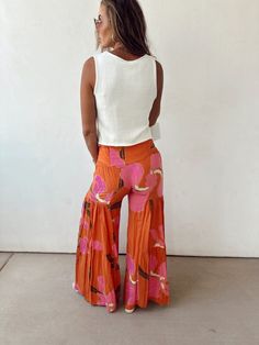 Tiered wide leg flare pants Ruffle Hem button Tie Waist with smocked waistbands on sides Run smalls. Size small 0-2, Medium size 4, Large 6-8 Wide Leg Flare Pants, Sunset Glow, Activewear Sets, Pants Large, Holiday Dresses, Hat Hairstyles, Flare Pants, Ruffle Hem, Bra Tops