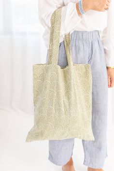 Carry all your essentials, and then some, in our soft, unstructured block print market tote. Great for gifting. Add a custom monogram for an extra thoughtful gift. Crafted in a mid-weight cotton, it's ready to travel, play, work, repeat. •Measuring 15.5"W x 17.5"L • Handle drop: 11" • 100% cotton block printed by hand. • Machine wash warm. White Hand Printed Cotton Canvas Bag, Cotton Hand Printed Bags For Everyday Use, Hand Printed White Cotton Canvas Bag, Hand Printed Cotton Bag For Gift, Hand Printed Cotton Tote Canvas Bag, Hand Printed Cotton Canvas Tote Bag, Eco-friendly Hand Printed Cotton Canvas Bag, Green Cotton Canvas Bag For Gift, Eco-friendly Hand Printed Canvas Bag For Everyday Use