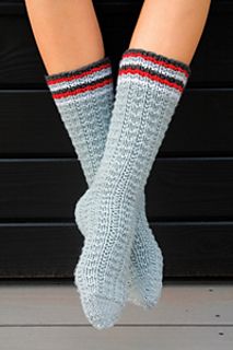 the legs of a woman wearing socks with red, white and blue stripes