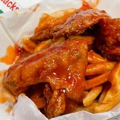 chicken wings and french fries in a basket