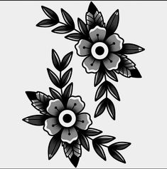 two black and white flowers with leaves on them