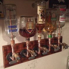 there are many different glasses on the wall