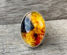 Luminescent Yellow Orange Black Sparkly Oval Agate Quartz Doublet Sterling Silver Statement Ring | Size 6.5 | Agate Ring | Quartz Ring by GildedBug on Etsy Spiritual Yellow Oval Jewelry, Oval Orange Cabochon Jewelry, Amber Cabochon Agate Jewelry, Amber Oval Agate Ring, Oval Amber Agate Jewelry, Orange Agate Cabochon Jewelry, Oval Amber Agate Ring, Oval Orange Agate Jewelry, Orange Oval Agate Jewelry